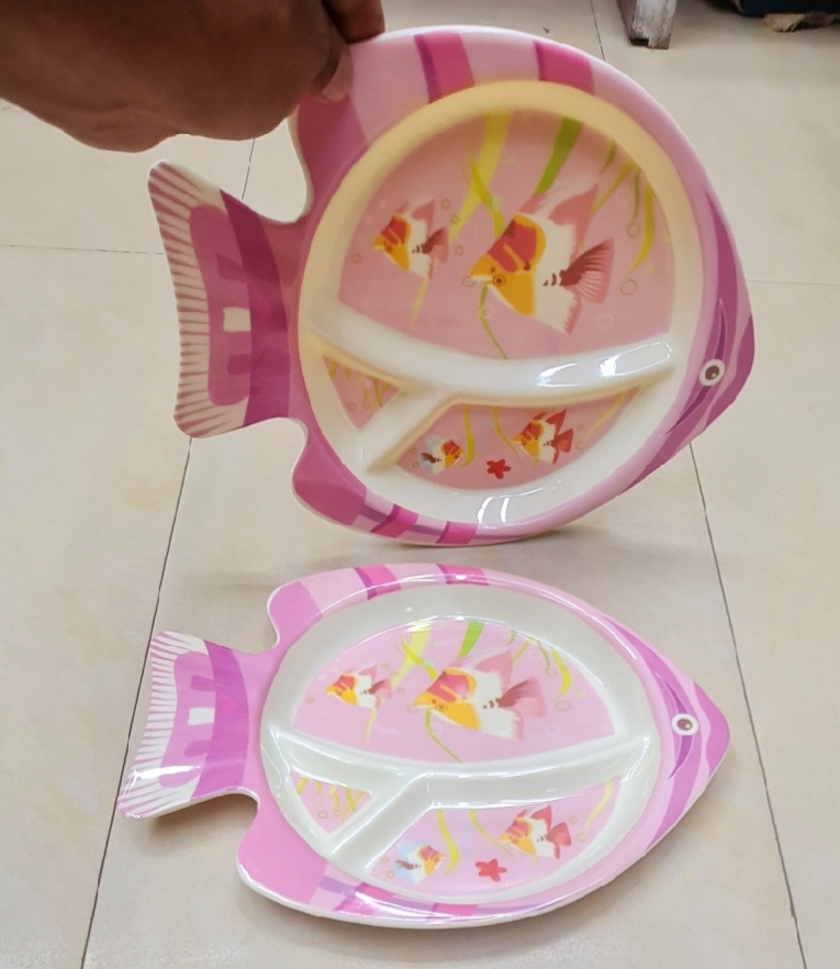 Picture of Our adorable baby fish plate make mealtime a splash with divided sections keep portions organized, while the cute fish design encourages little ones to gobble up their food. Made from safe, food-grade materials, it's perfect for tiny hands