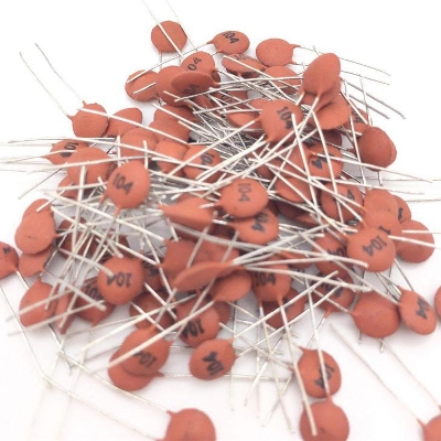 Picture of 25Pcs- 100nF 50V 104 CERAMIC Capacitor Mini Ceramic Capacitor 104 100nF 50V Ceramic Disc Capacitor Non-Polarized Through Hole 2 Pin Leads Connections Leg