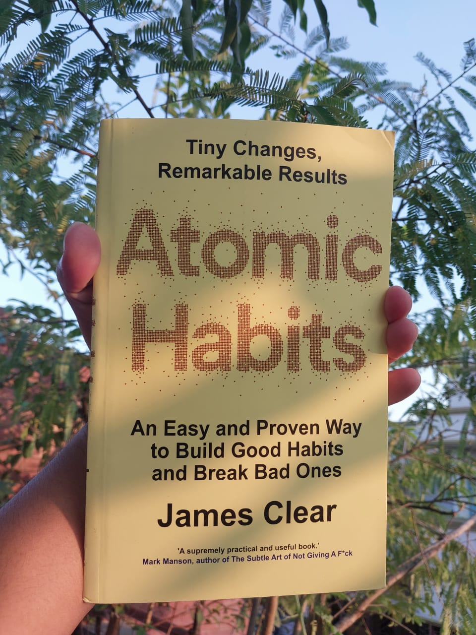 Picture of Atomic Habits: An Easy & Proven Way to Build Good Habits & Break Bad Ones by James Clear (Yellowish Paperback)