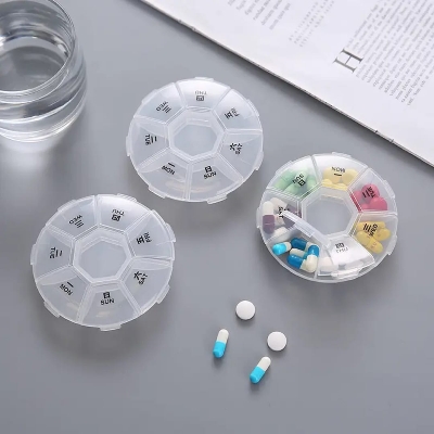 Picture of 7 Compartments Portable Round Mini Plastic Pill Box Medicine Box Travel Pill Storage Case 7 Days Weekly Pill Organizer