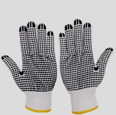 Picture of Knitted cotton and PVC dotted hand gloves are ideal for various tasks including construction, industrial work, welding, kitchen activities, and gardening. This product comes in a package of one pair, providing a reliable grip and protection while ensuring