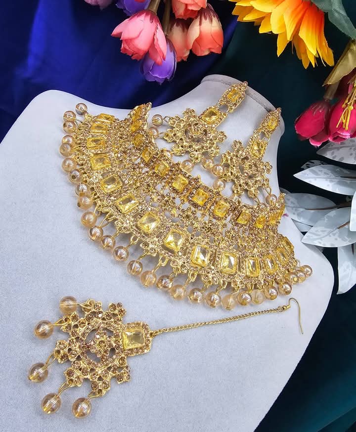 Picture of Unique golden  Stone Bridal Choker Necklace with Earrings and Tikka Picture of Unique golden  Stone Bridal Choker Necklace with Earrings and Tikka
