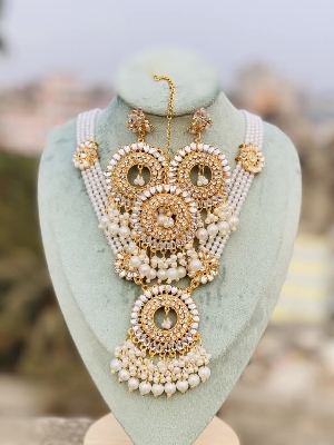 Picture of Uncommon Hyderabadi pearl Kundan choker necklace set.  Picture of Uncommon Hyderabadi pearl Kundan choker necklace set.