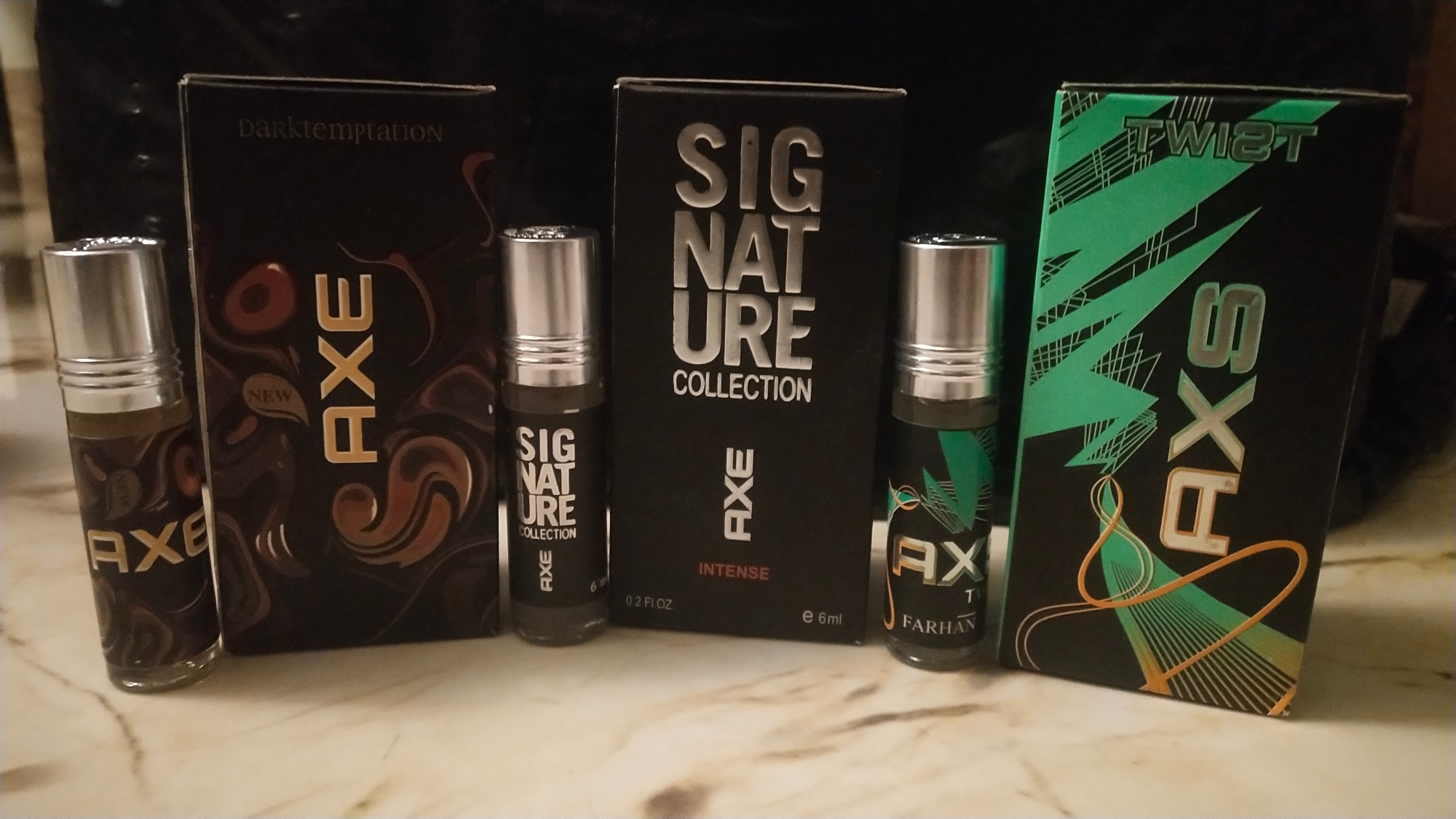 Picture of Combo of A.X.E Signature,  A.X.E Twist &  A.X.E Dark Temptation  By Al Farhan Concentrated Perfume Oil Long Lasting Fragrance - 6ml+6ml+6ml Picture of Combo of A.X.E Signature,  A.X.E Twist &  A.X.E Dark Temptation  By Al Farhan Concentrated Perfume Oil Long Lasting Fragrance - 6ml+6ml+6ml