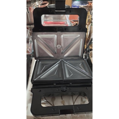 Picture of 3_in_1 Functionality: This appliance includes interchangeable plates for making sandwiches, waffles, and grilling.