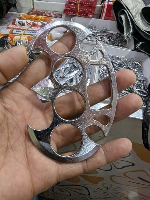 Picture of Photography Old metal brass knuckles knuckledusters with spikes isolated on white background injuries, street fights, fights without rules, urban crime