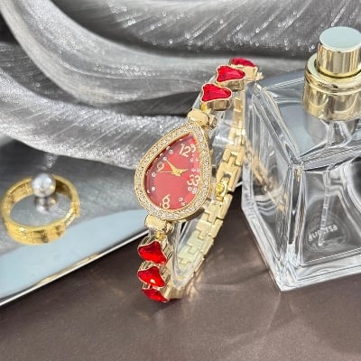 Picture of Elegant freestyle quartz watch for women with embedded diamonds, water drop shaped water box, colorful heart bracelet