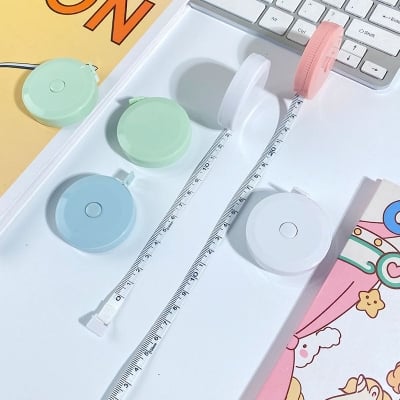 Picture of 60-Inch 1.5 Meter Soft Retractable Tape for Tailor Sewing Craft Dieting Measuring for Industrial Use - Multicolor