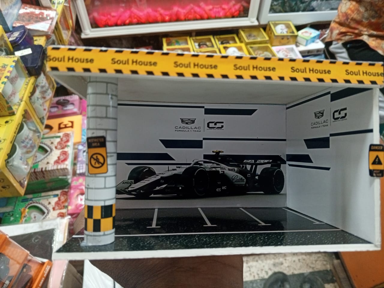 Picture of small-scale model F1 car display case or diorama,
