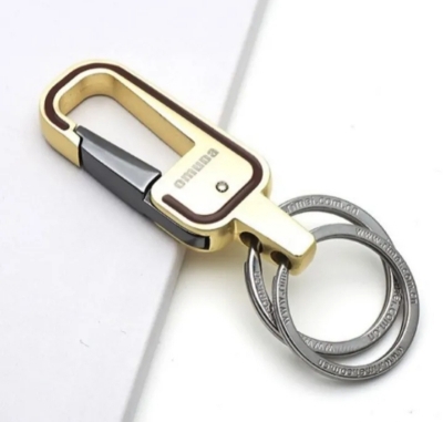 Picture of gold colour key chain for bike,car,house,office and others uses.