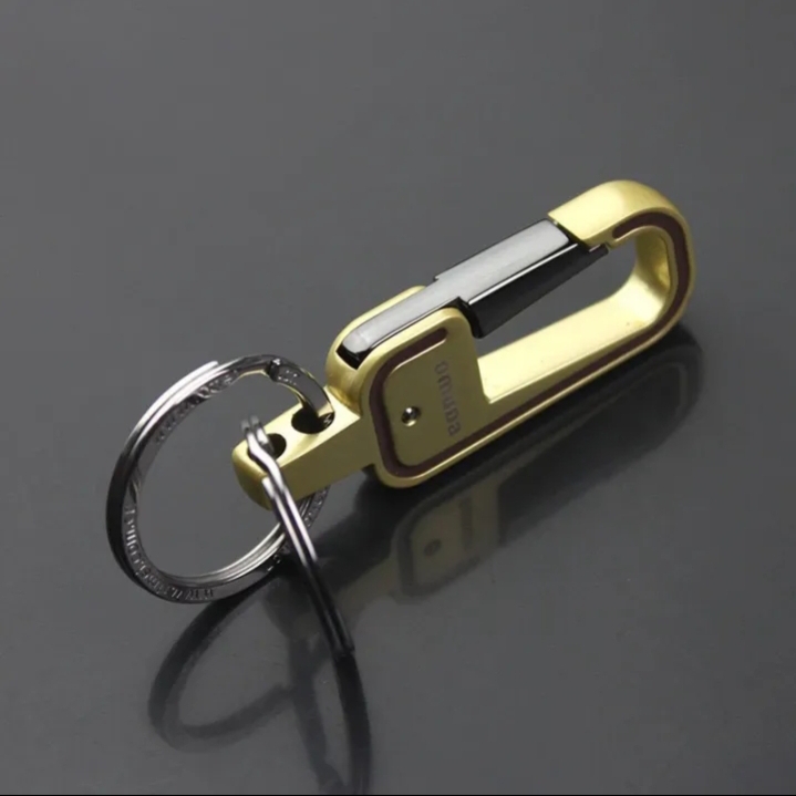 Picture of gold colour key chain for bike,car,house,office and others uses.