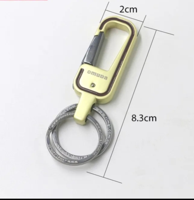 Picture of gold colour key chain for bike,car,house,office and others uses.