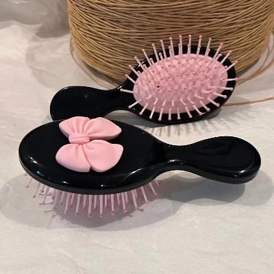 Picture of Bowknot Handle Comb Scalp Massage Travel Portable Plastic Air Cushion Small Comb Hair Brush Bow Tie Sweet Cute Comb