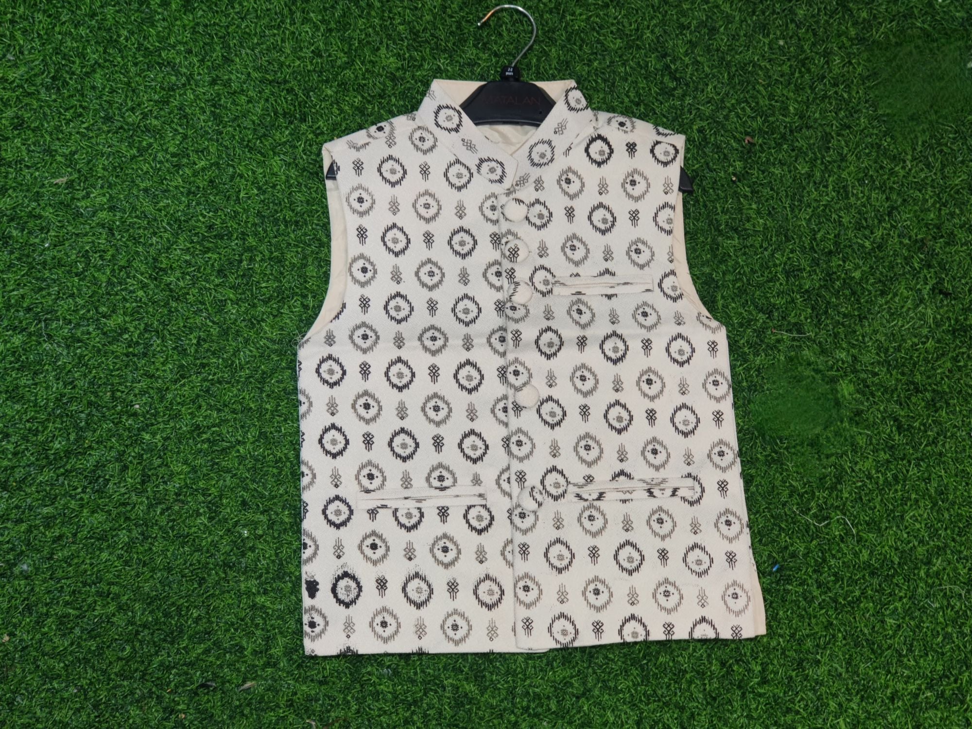 Picture of white ptinted waist coat for boys