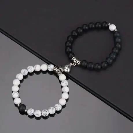 Picture of Magnetic Heart Bracelets for Couples (2 Piece) | Small Rubber Band Magnet Stone Bell Bracelet with Knotted Head Rope