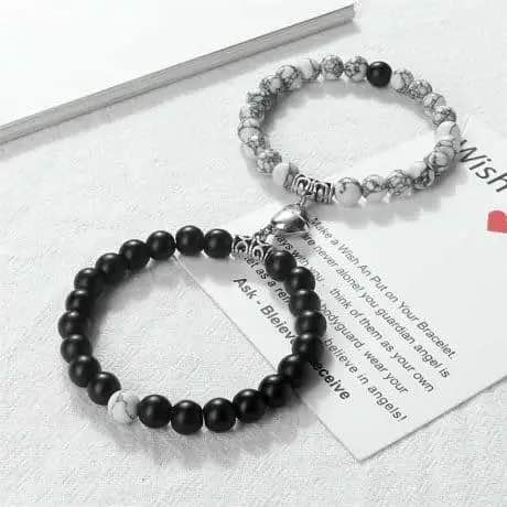 Picture of Magnetic Heart Bracelets for Couples (2 Piece) | Small Rubber Band Magnet Stone Bell Bracelet with Knotted Head Rope