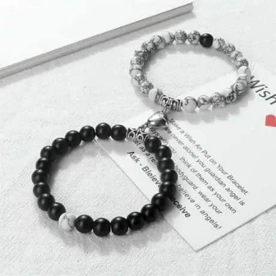 Picture of Magnetic Heart Bracelets for Couples (2 Piece) | Small Rubber Band Magnet Stone Bell Bracelet with Knotted Head Rope