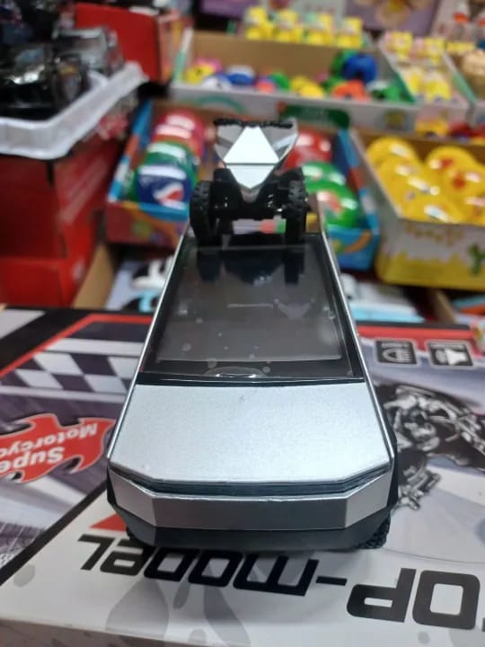 Picture of 1:28 Tesla Cybertruck Diecast Metal Alloy Model car Sound Light Pull Back Collection Kids Toy Gifts - Multicolor