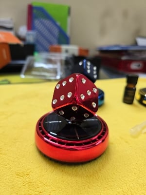 Picture of Solar Rotating Dice Car Perfume – Stylish & Fresh Ride
