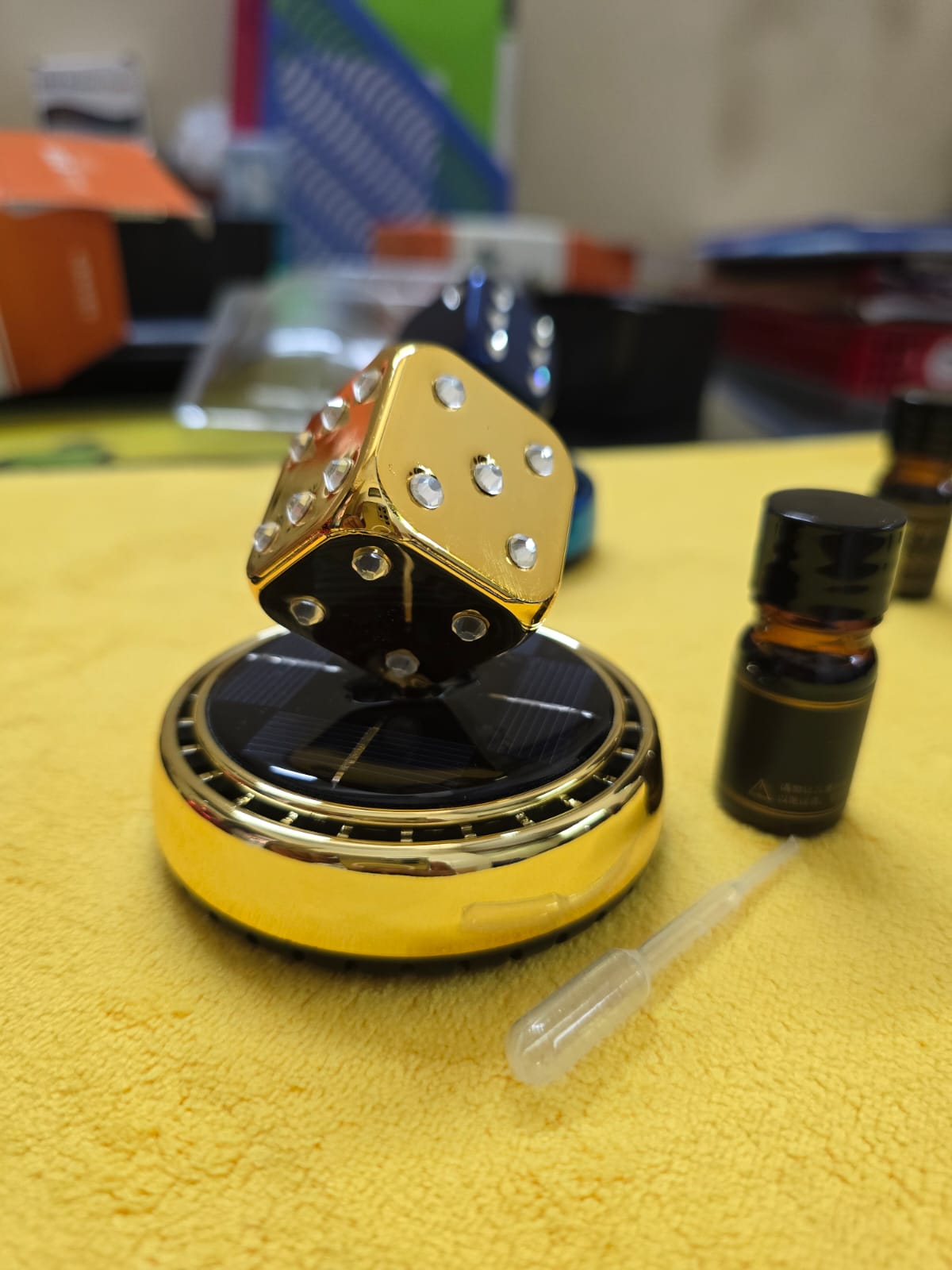 Picture of Solar Rotating Dice Car Perfume – Stylish & Fresh Ride