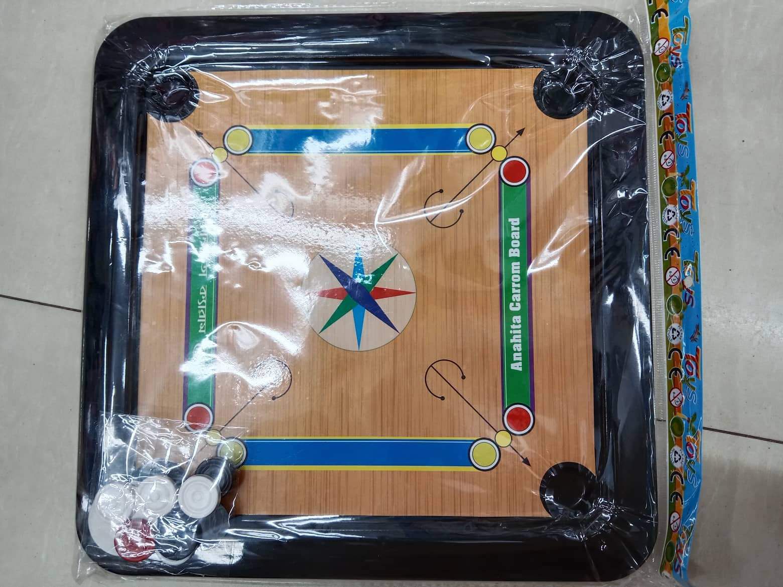 Picture of Plastic Carrom Board (Both side play : One side Carrom board & Other side Ludu ).Board game - Multi color - (14X14) Inch (Multicolor)
