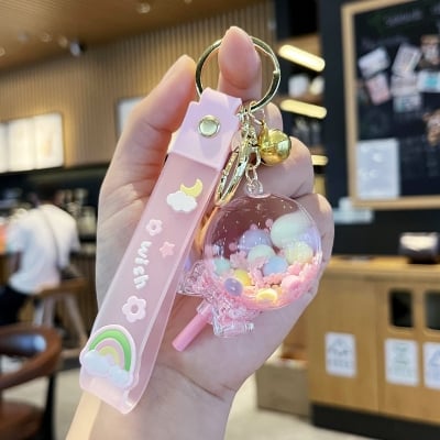 Picture of Creative Liquid Quicksand Lollipop Keychain – Cute Pastel Floating Charm Keyring with "Wish" Silicone Wristlet Strap for Bags, Keys, & Gifts (Pink)