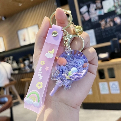 Picture of Creative Liquid Quicksand Lollipop Keychain – Cute Pastel Floating Charm Keyring with "Wish" Silicone Wristlet Strap for Bags, Keys, & Gifts (Purple)
