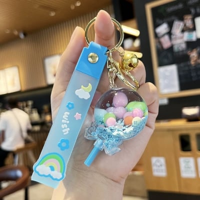 Picture of Creative Liquid Quicksand Lollipop Keychain – Cute Pastel Floating Charm Keyring with "Wish" Silicone Wristlet Strap for Bags, Keys, & Gifts (Blue)
