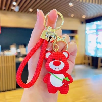 Picture of Cute 3D Strawberry Bear Keychain – Kawaii Knitted-Texture Cartoon Bear Bag Charm with Braided Leather Strap & Bell for Girls/Kids (Hotpink)
