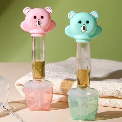 Picture of Infant Health in Style: Cartoon Bear Baby Dropper Feeder - Smart Medicine Dispensing Solution - Multicolor