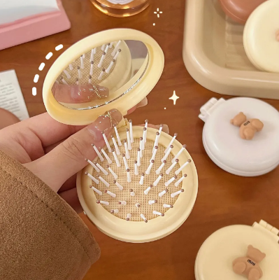 Picture of Mini Folding Hair Brush for Women with Integrated Mirror