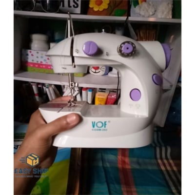 Picture of 8 in 1 Mini Sewing Machine - Dual Speed Portable Mini Electric Pedal Double Threads Rewind Swing Machine Multicolor 