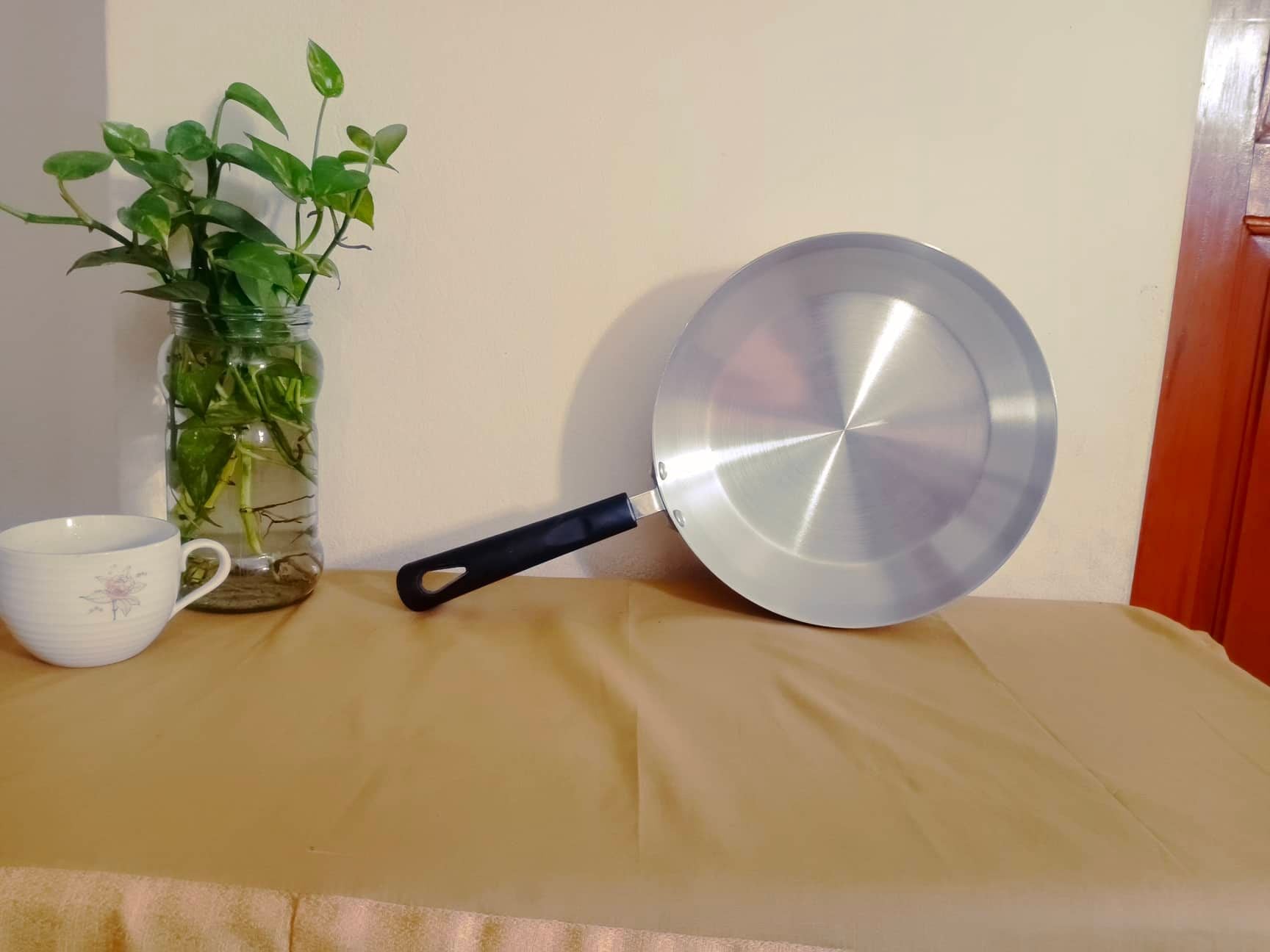 Picture of 25 cm aluminiam Roti Tawa with long handle Silver 