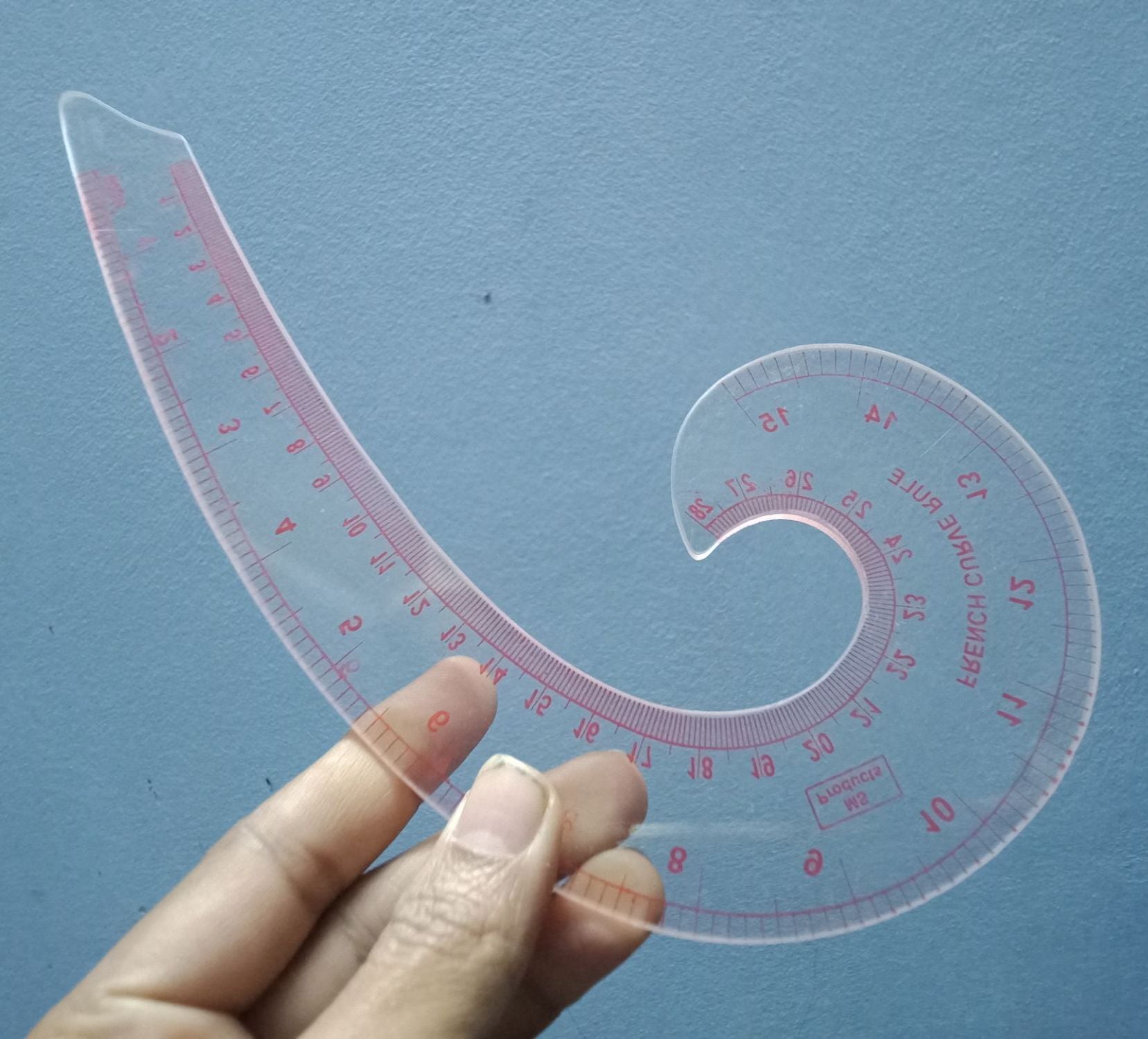 Picture of Plastic Comma Shape French Curve Ruler for Pattern Making, Sandwich Line Scale, Vary Form Curve Ruler for Sewing, Clear Muti Function Sewing Ruler for Fashion Design Red 