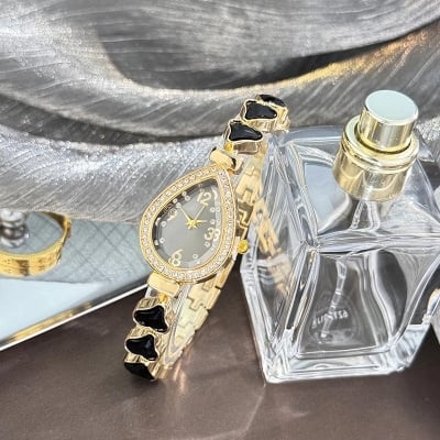 Picture of Elegant freestyle quartz watch for women with embedded diamonds, water drop shaped water box, colorful heart bracelet