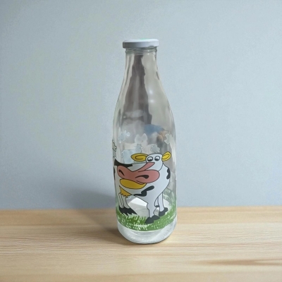 Picture of Reusable Glass Bottle with Cow Print – Airtight & Durable – 1 Litre Capacity – Essentials Brand – Perfect for Milk, Juice, Water – Eco-Friendly Option for Daily Beverage Storage-Multicolor