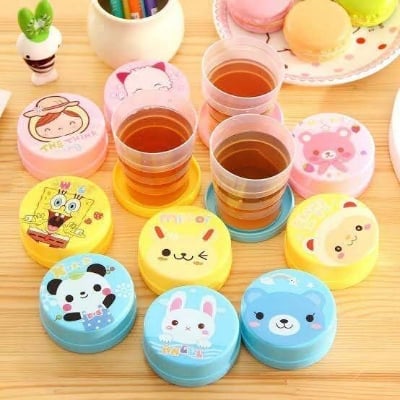 Picture of Folding Cup With Lid Portable Reusable Plastic Water Cup Cartoon Collapsible Mouthwash Cup Travel Outdoor Drinking Cup Kids Cartoon Drinking Cup Portable Cartoon Printed Plastic Foldable Magic Cup Glass for kids Birthday Gift