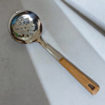 Picture of Single Piece 10 Inch Stainless Steel Round Slotted Kitchen Spoon, Silver, with Non-Magnetic Wooden Color Plastic Handle Cover. Perfect for Cooking and Serving, Durable and Stylish for Any Kitchen.-Silver