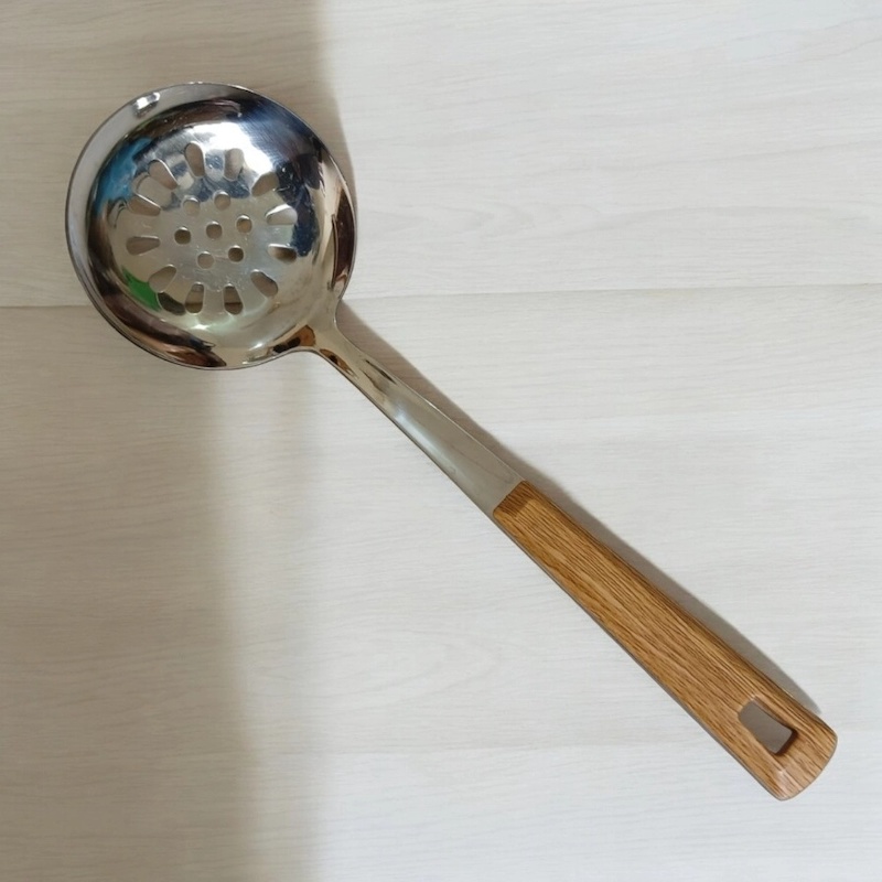Picture of Single Piece 10 Inch Stainless Steel Round Slotted Kitchen Spoon, Silver, with Non-Magnetic Wooden Color Plastic Handle Cover. Perfect for Cooking and Serving, Durable and Stylish for Any Kitchen.-Silver