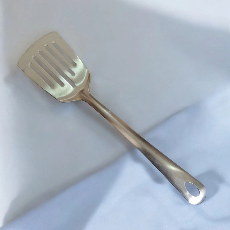 Picture of 10 Inch Slotted Turner Spoon, Silver Stainless Steel, Non-Magnetic. Ideal for Cooking and Serving, Combines Durability and Efficiency for Flipping and Serving Foods.-Silver