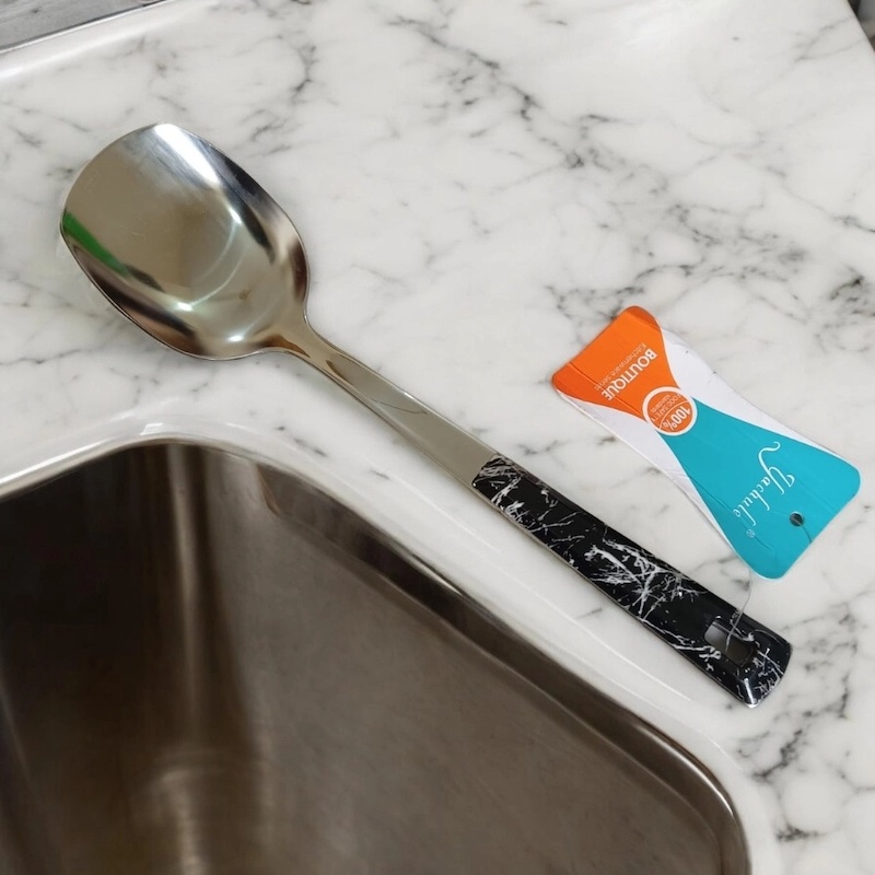 Picture of 10 Inch Solid Turner Spoon, Silver Stainless Steel, Non-Magnetic. Elegant Marble Stone Black Color Cover Plastic Handle. Perfect for Cooking and Serving, Effortless Handling in Any Kitchen.-Silver