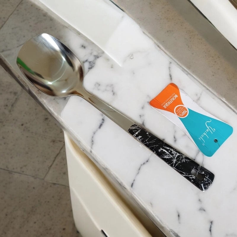 Picture of 10 Inch Solid Turner Spoon, Silver Stainless Steel, Non-Magnetic. Elegant Marble Stone Black Color Cover Plastic Handle. Perfect for Cooking and Serving, Effortless Handling in Any Kitchen.-Silver
