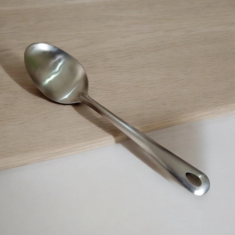 Picture of 10 Inch Silver Serving Spoon, Stainless Steel, Non-Magnetic. Perfect for Cooking and Serving, This Single Piece Ensures Efficiency and Style in Your Kitchen.-Silver