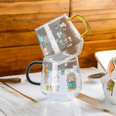Picture of Borosilicate Glass Cartoon Printed Breakfast Cups - 400ml, Set of 2, Lightweight, Microwave Safe, Fireproof for Oven Use, Perfect for Hot & Cold Drinks. Stylish Color Handles.-Clear