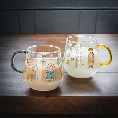 Picture of Borosilicate Glass Cartoon Printed Breakfast Cups - 400ml, Set of 2, Lightweight, Microwave Safe, Heat Resistant, Fireproof for Oven, Perfect for Hot & Cold Beverages. Colorful Handles Included.-Clear