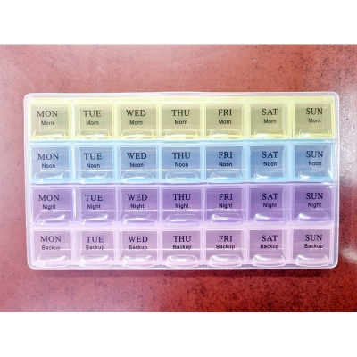 Picture of 7 Days Medicine Kit box organizer with 28 grids Week day medicine box from Morning-noon-night - Medicine Box Multicolor