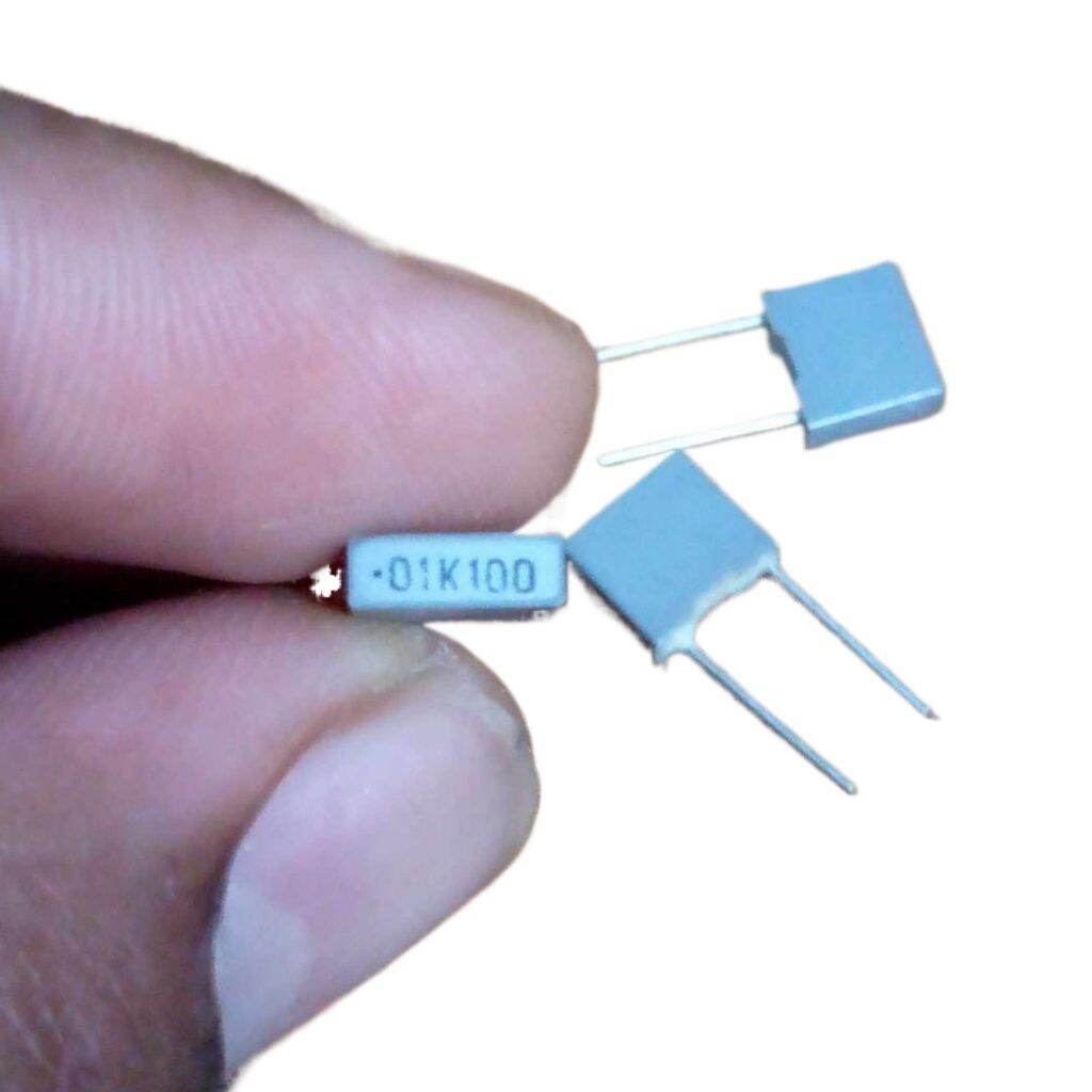 Picture of 15Pcs - BOX TYPE 0.01K 10nF 103J 0.01uf 100VAC Polypropylene Metal Film Box Capacitor Axial Film Molded 100nF 100VAC Capacitors 2 Pin Leads 103J Capacitor