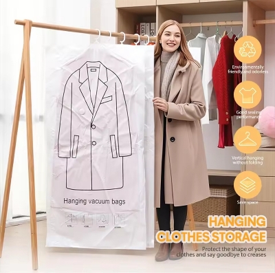 Picture of Hanging Vacuum Compression Storage Bag + Hand Pump for Jacket, Quilt, Coats, Suits, Dresses etc. Travel organizer for luggage, Large Capacity Wardrobe Organizer for Clothes | Space Saver | Reusable Dustproof Wardrobe Bag - hanging bag 100*70CM