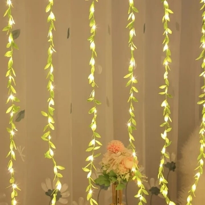 Picture of 2 Meter Willow Leaf Fairy String Lights with 20 LEDs – Battery Operated Decorative Garland Light with 3 Lighting Modes for Bedroom, Wall, Window, Wedding, Party & Home Decoration Gold