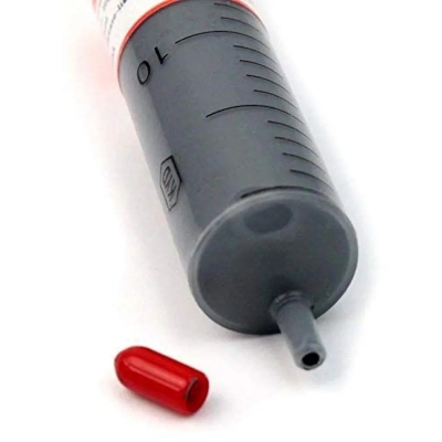 Picture of syringe of thermal paste, also known as thermal grease or heat sink compound. 